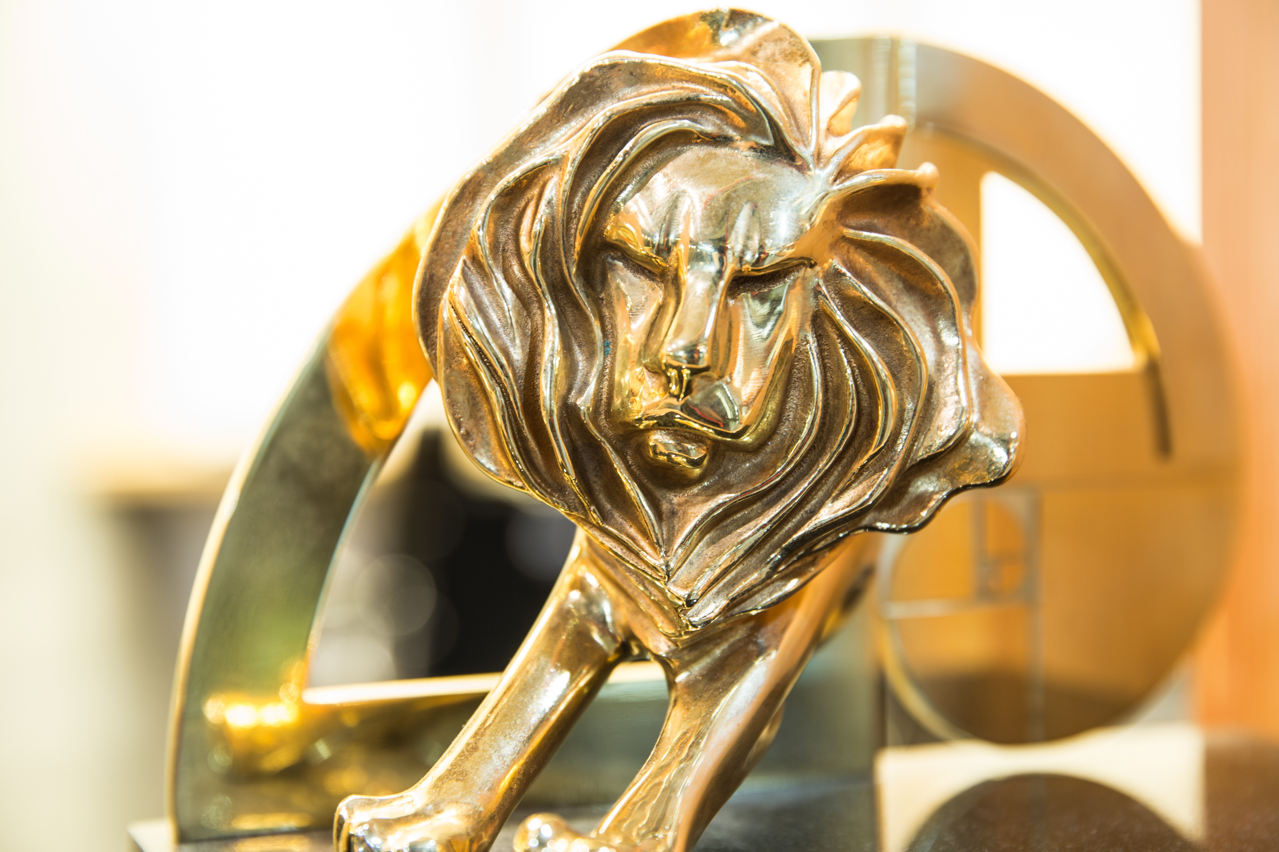 Golden Cannes Lions trophy highlighting how award-winning creative correlates with stronger brand performance and marketing ROI.