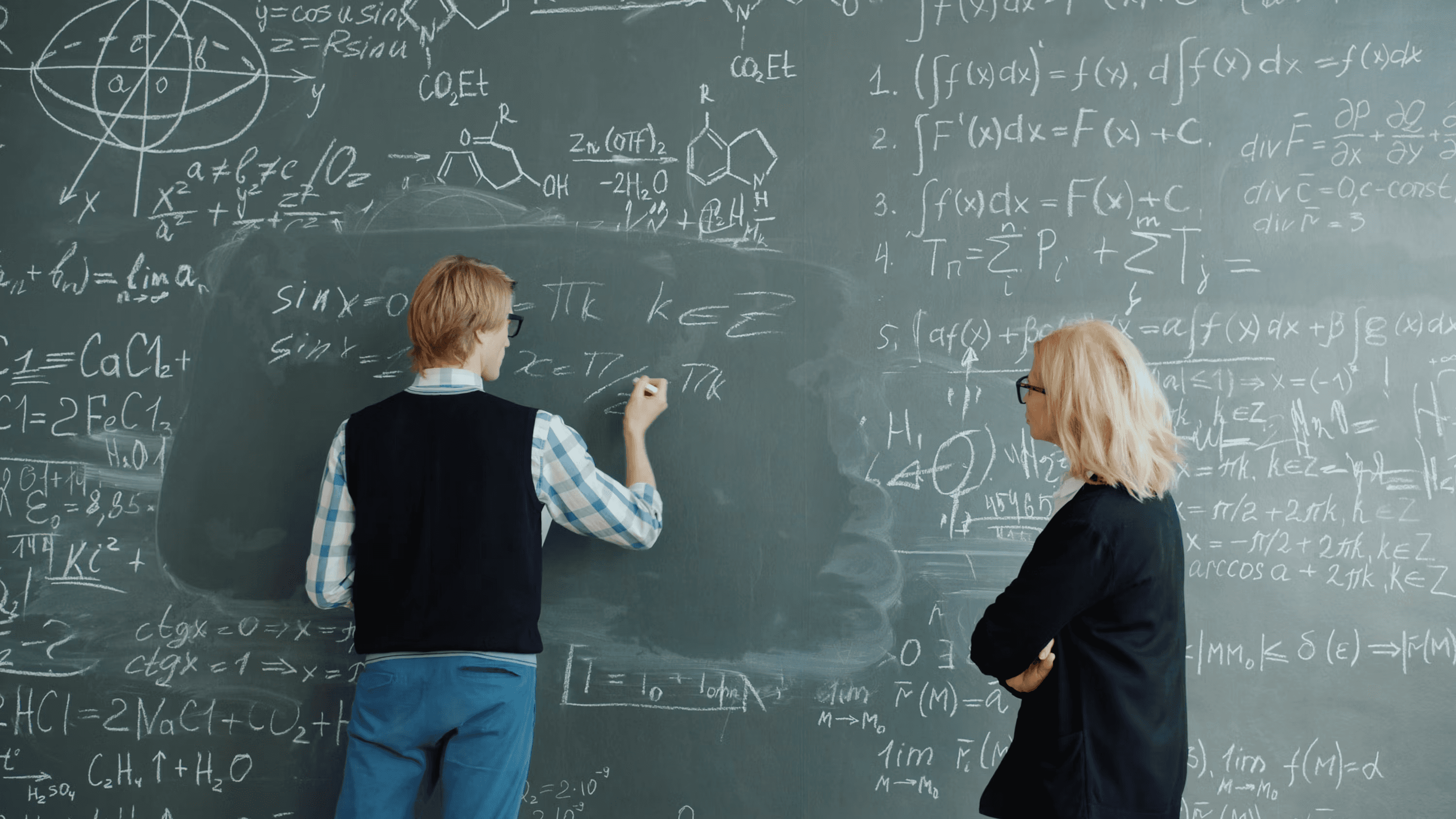 High school student conducting cognitive science research with a PhD mentor at a university library