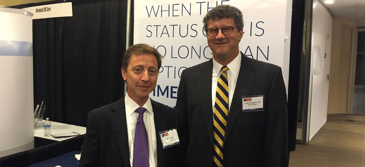 LifeLinc Anesthesia founders at an industry conference booth