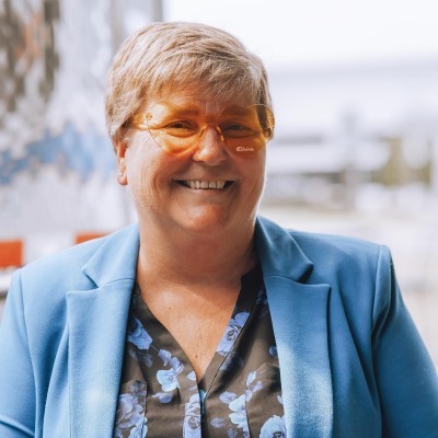 woman in black long sleeve shirt sitting on white couch