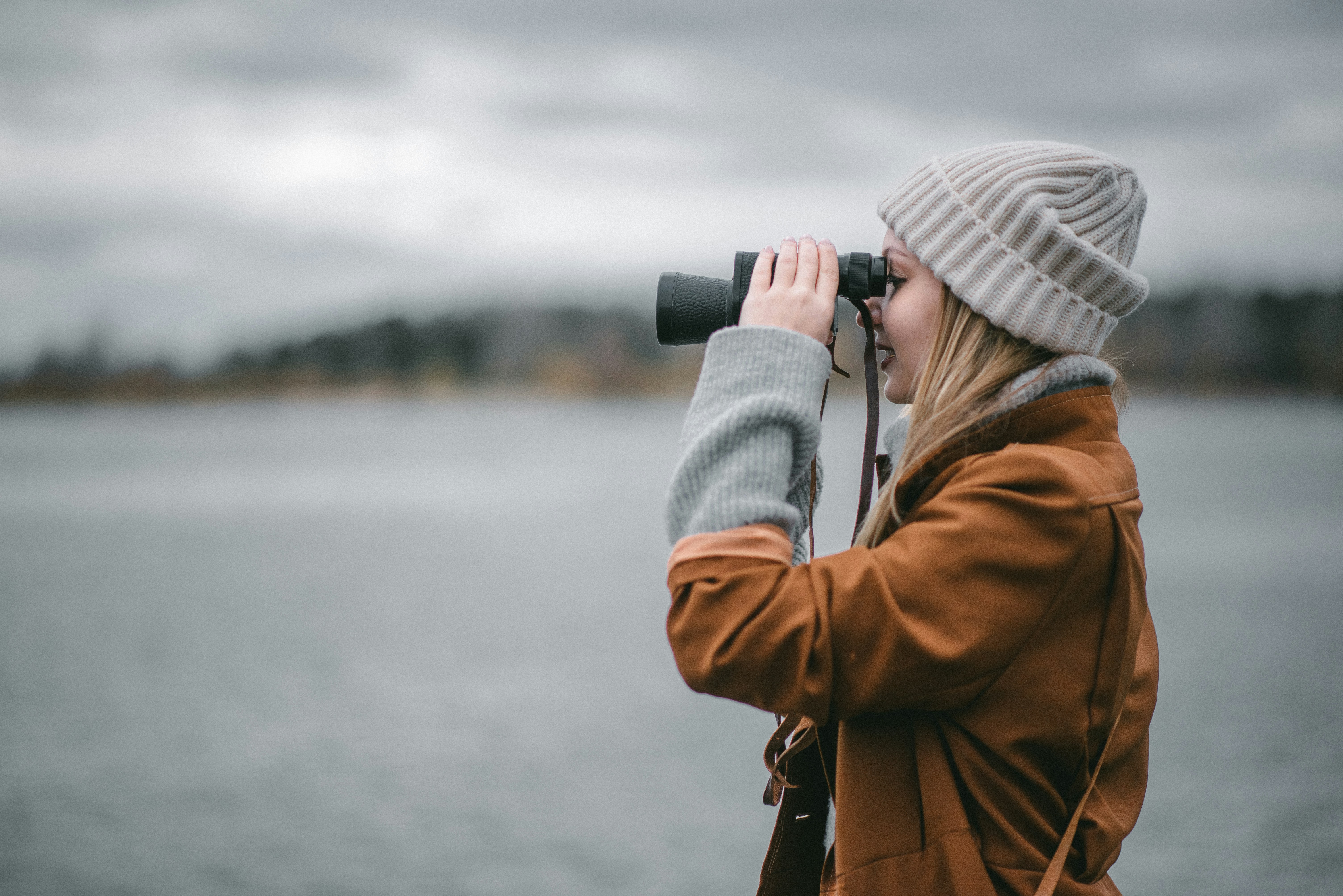 a man looking through a camera