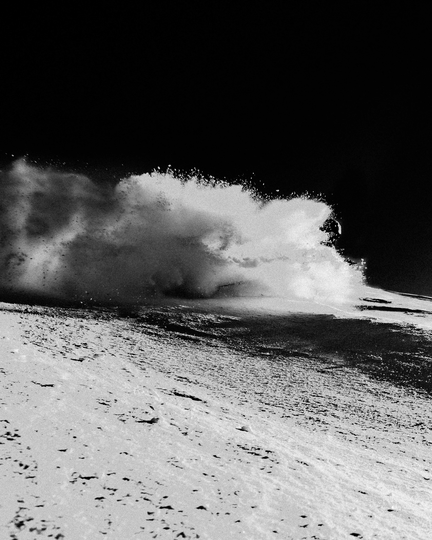 abstract picture of a skier coming out of a snow cloud.