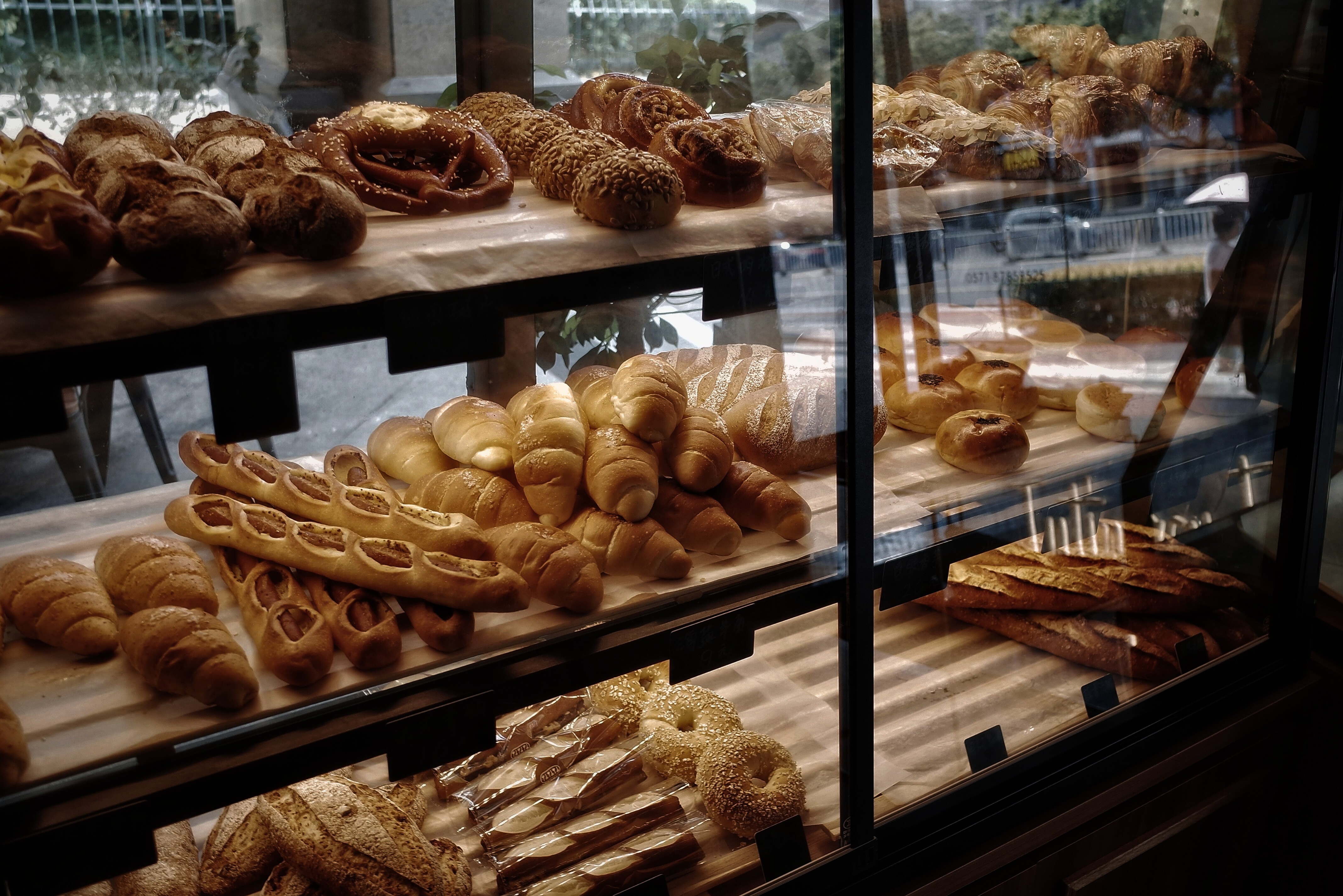 high-angle photography of bread store by day