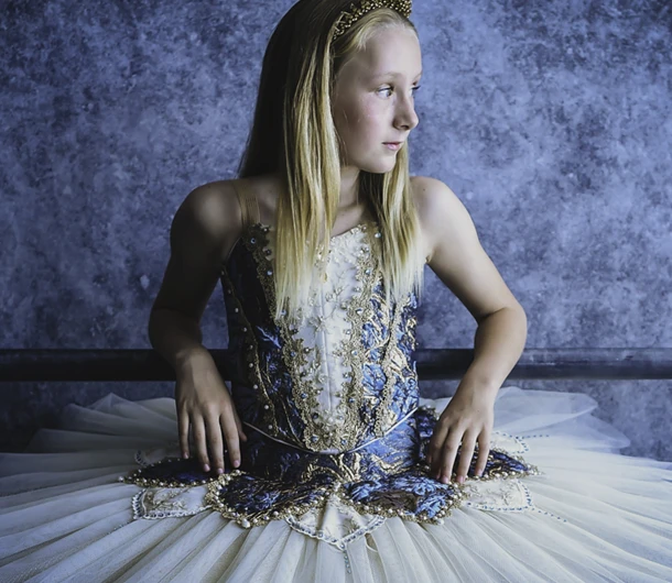 Junior student wearing a detailed tutu on photo day in the HDF studio
