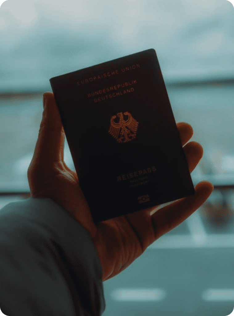 Hand holidng a country international passport