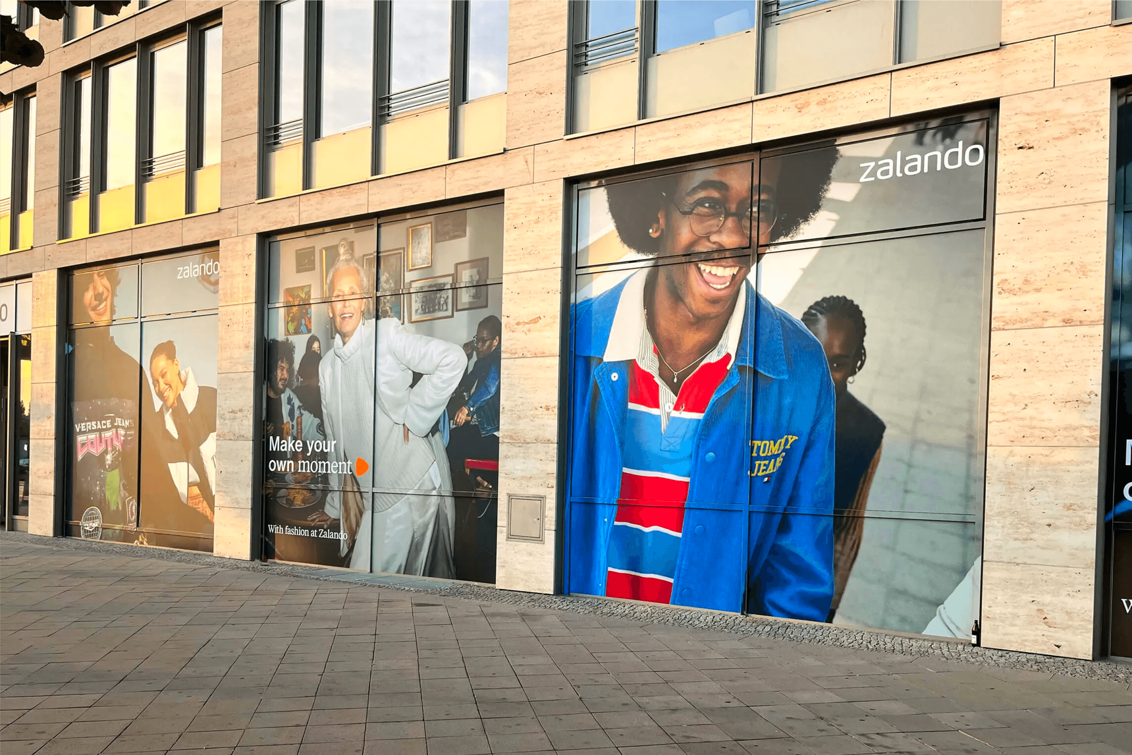 Sunlit narrow european street with colorful buildings