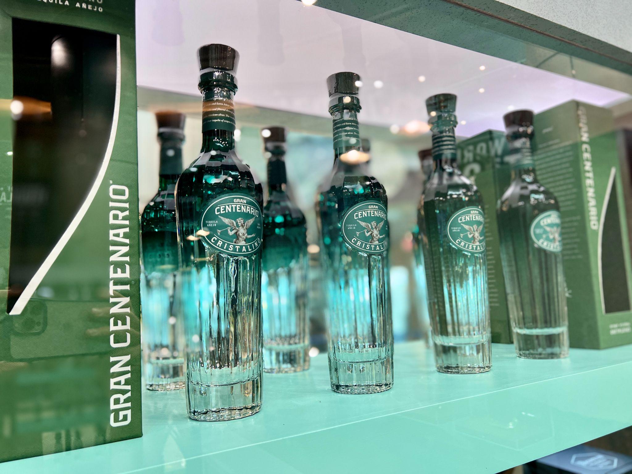 teal tequila bottles in a row