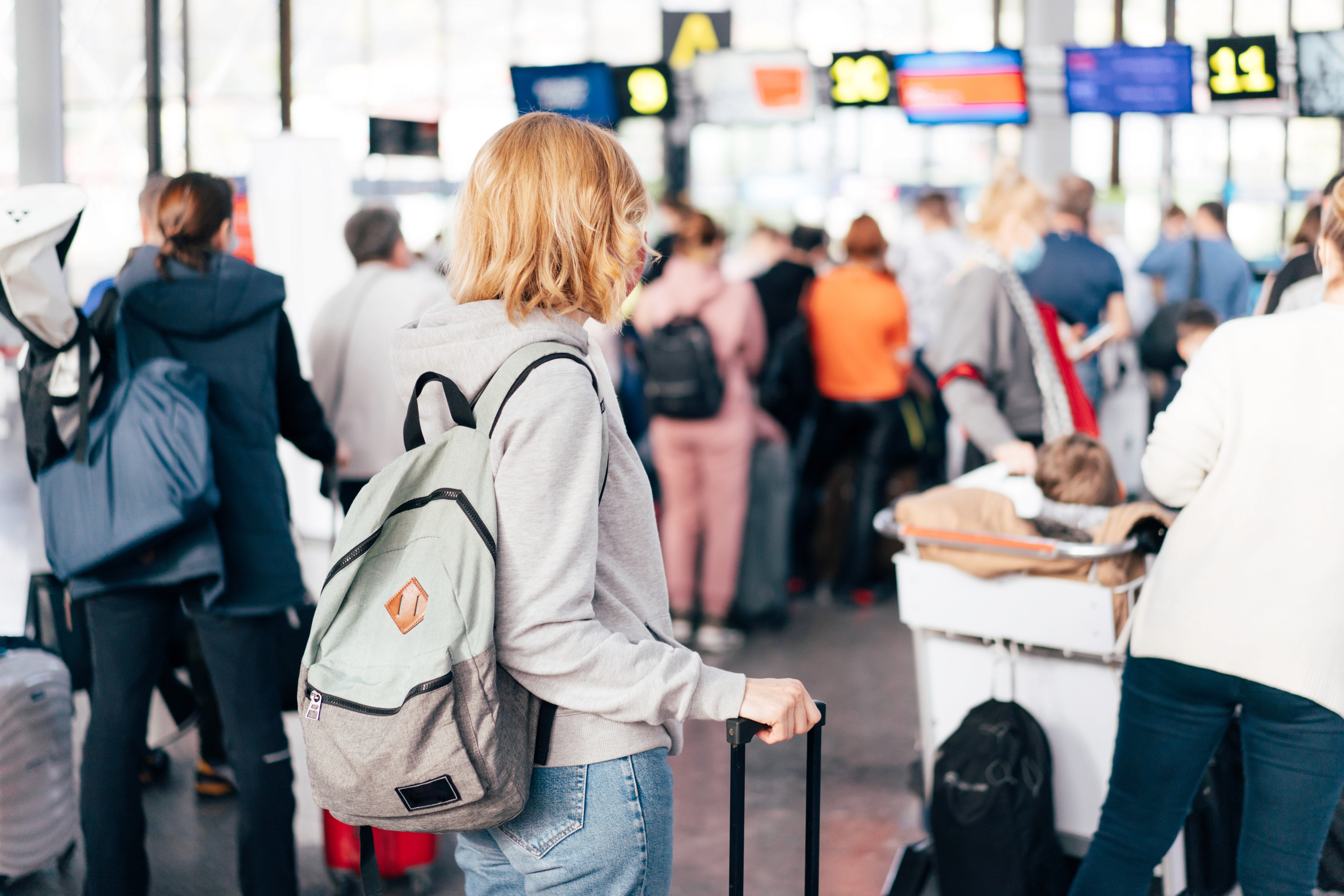 A generic photo of people standing around in an airport