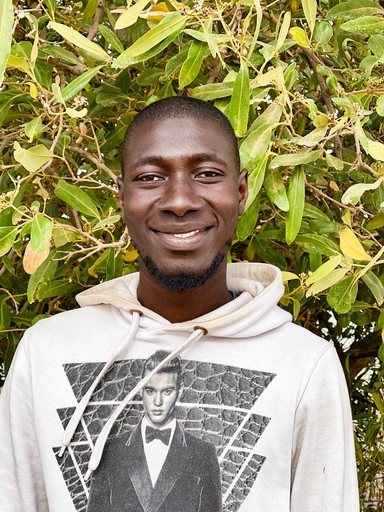 Portrait of a young adult man in front of mangrove leaves