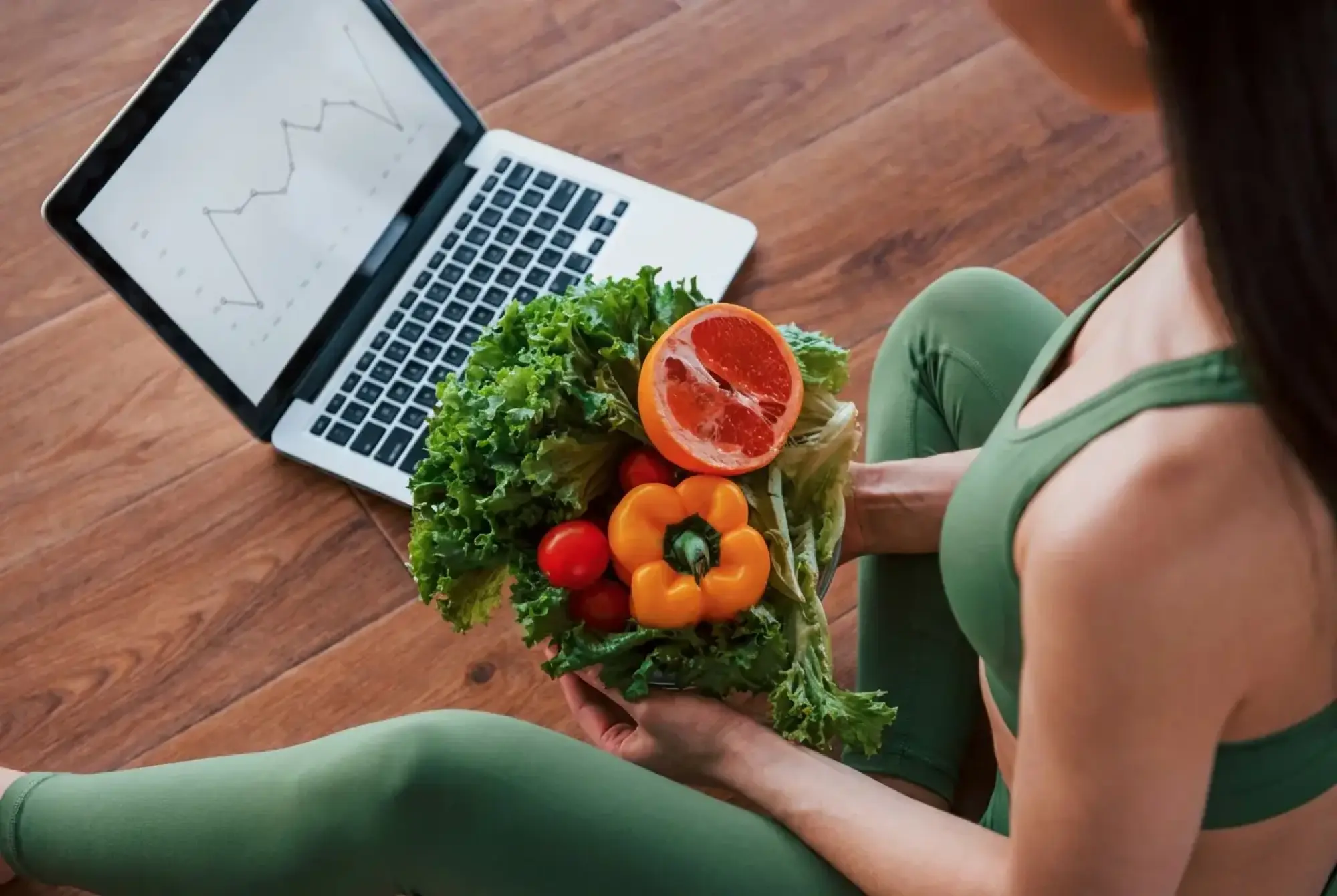 woman wearing gray long-sleeved shirt facing the sea