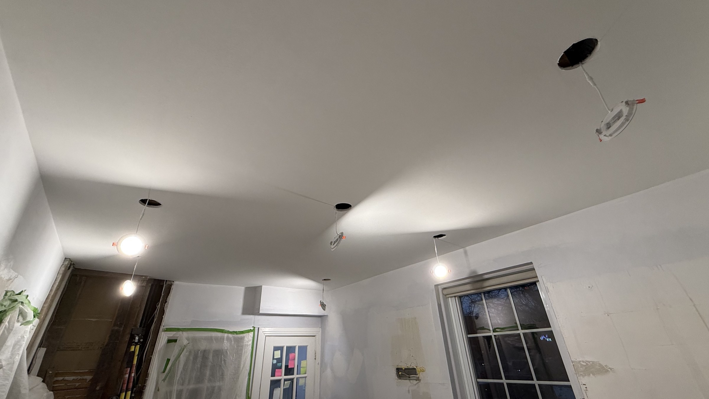 New drywall and recessed lighting installed during the rebuild