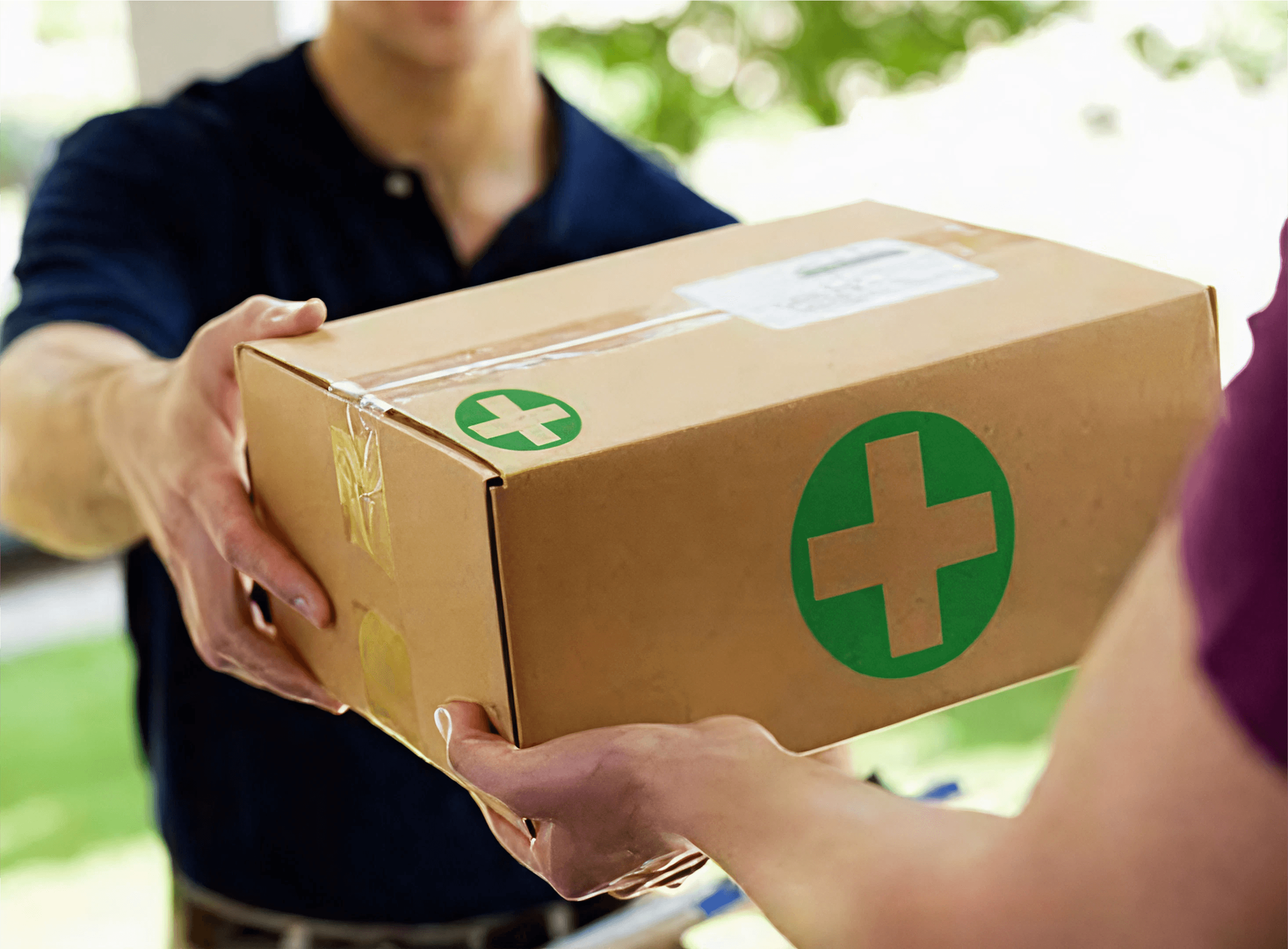 Doorstep medicine delivery box with green medical cross symbol