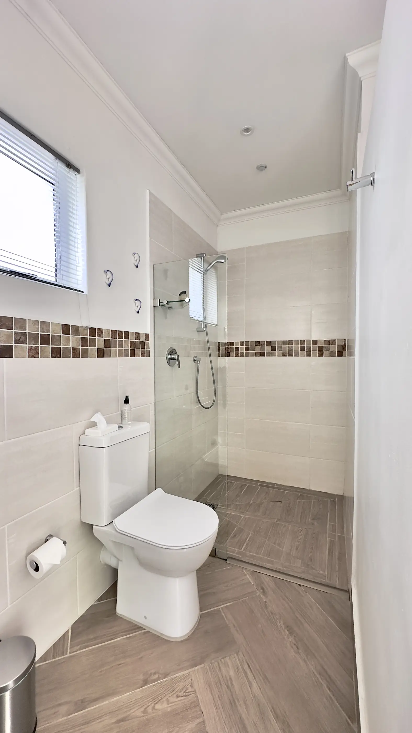 The toilet and shower in our A View Twenty-Four 7 room.