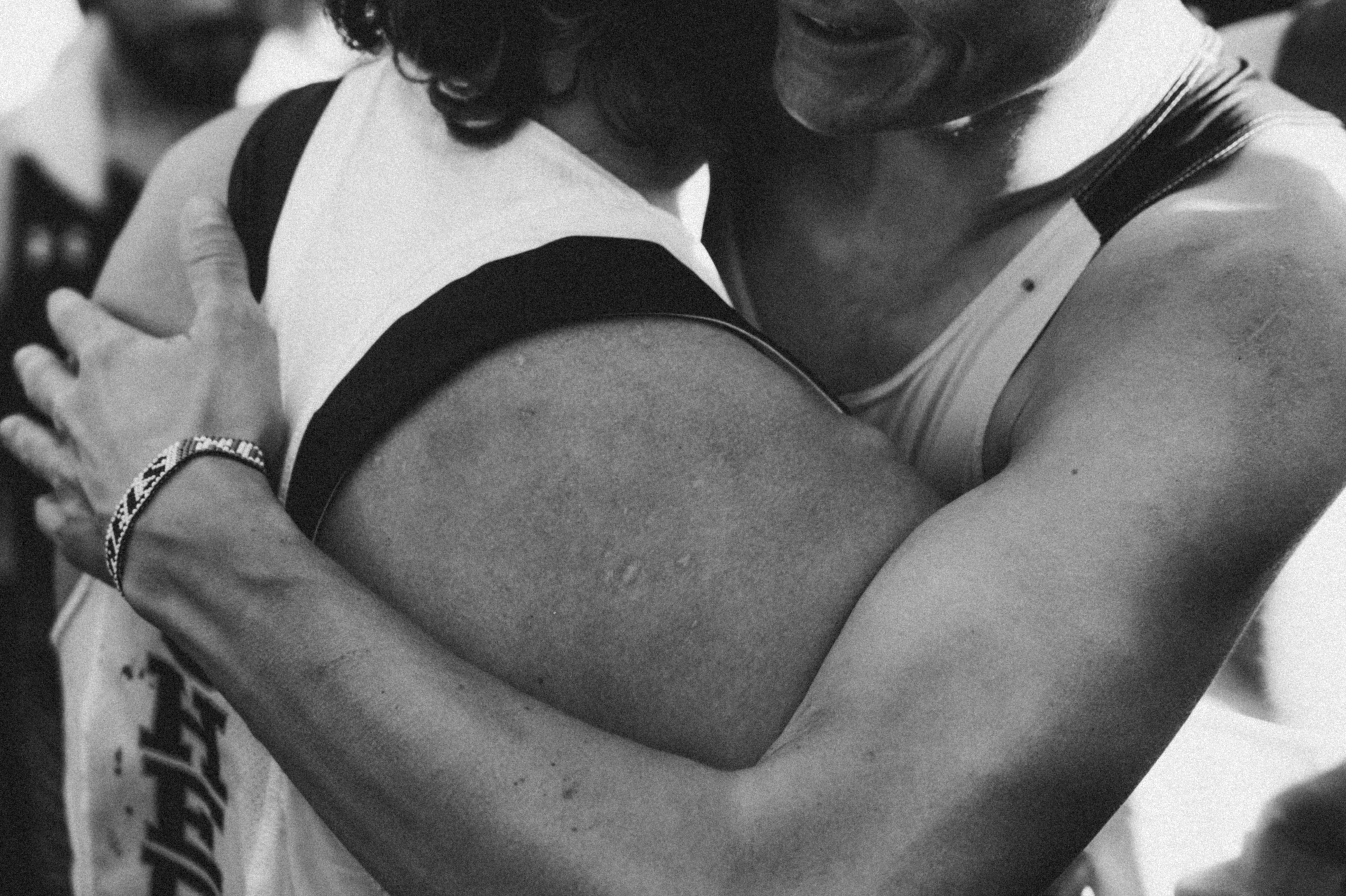 People embracing in a warm moment, representing Linqa’s mission of genuine human connection.