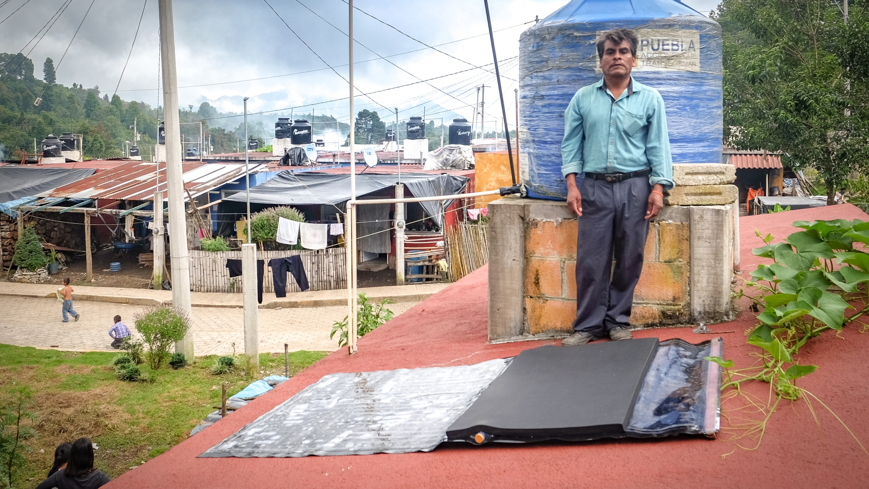Man standing next to Sun Tap prototype.