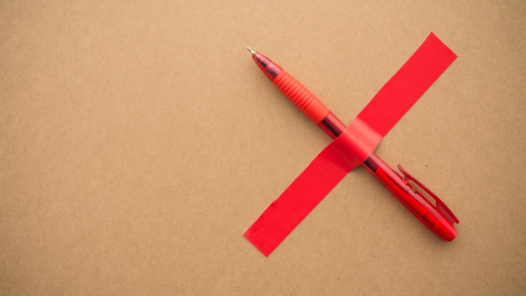 Image of read x with a pen