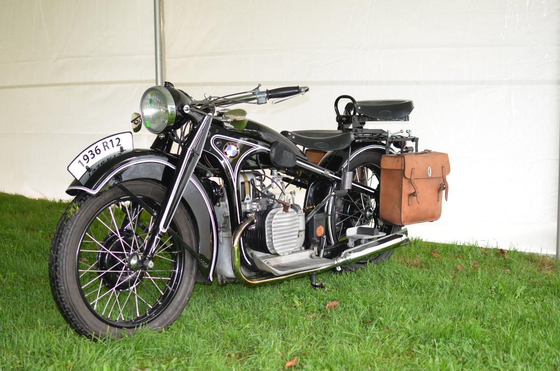 A man stading with Surfboard