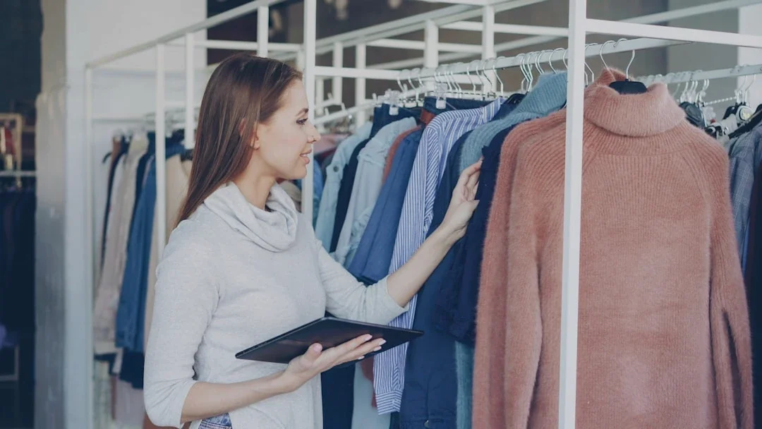 Woman shopping for clothes in a boutique.