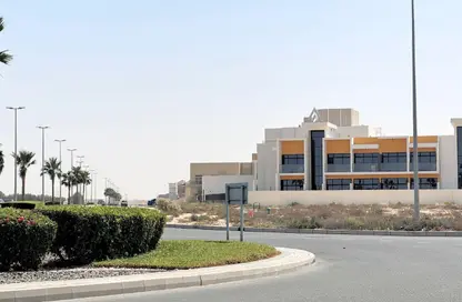 Street view of a contemporary low-rise development near Saih Shuaib 2 community.