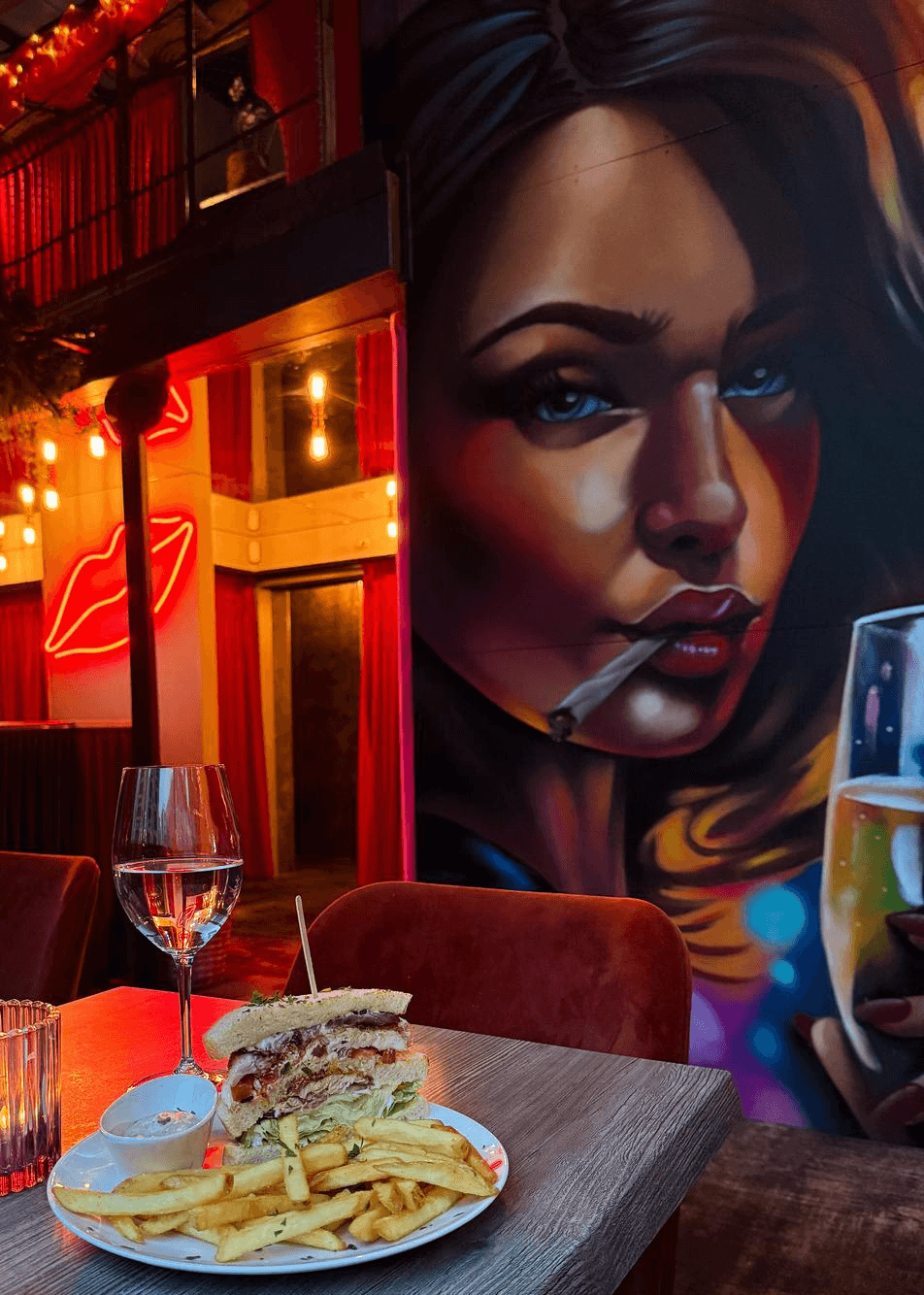 Portrait of a woman standing at a bar