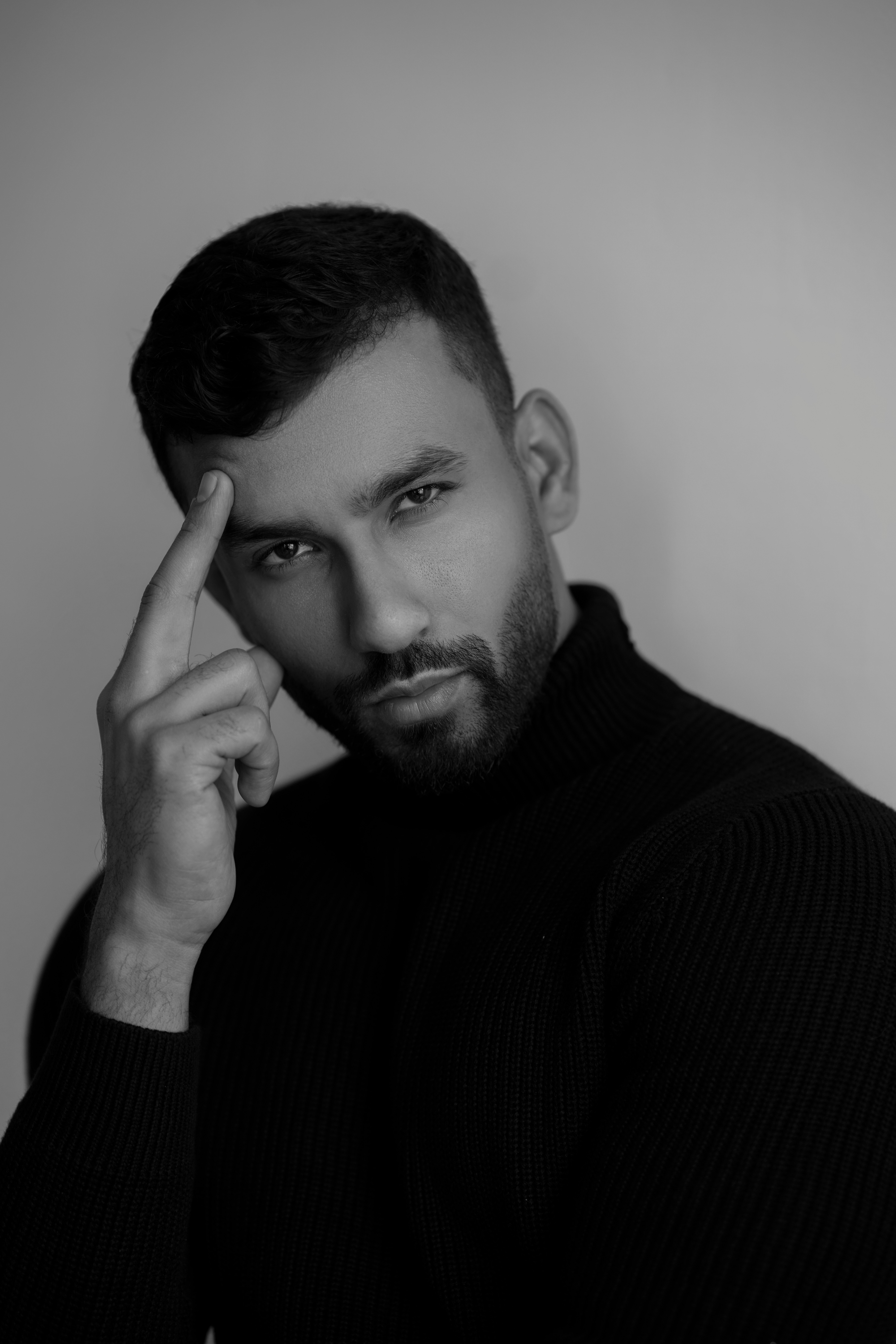 a black and white photo of a man with a beard