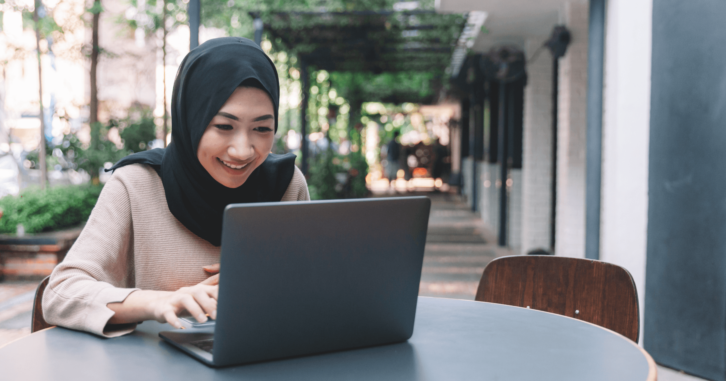 A Malaysian business owner on her laptop