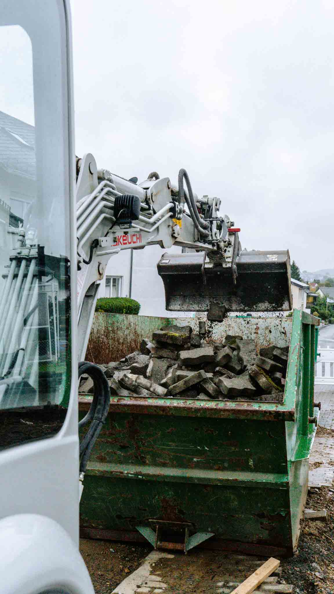woman sitting around table holding tablet