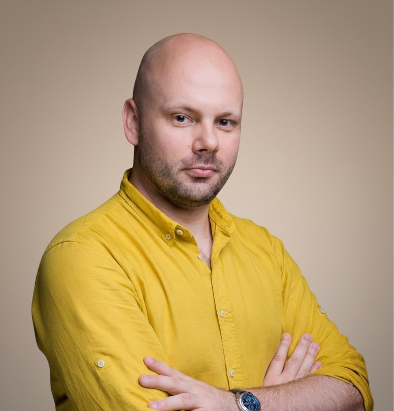 woman in brown coat using macbook air