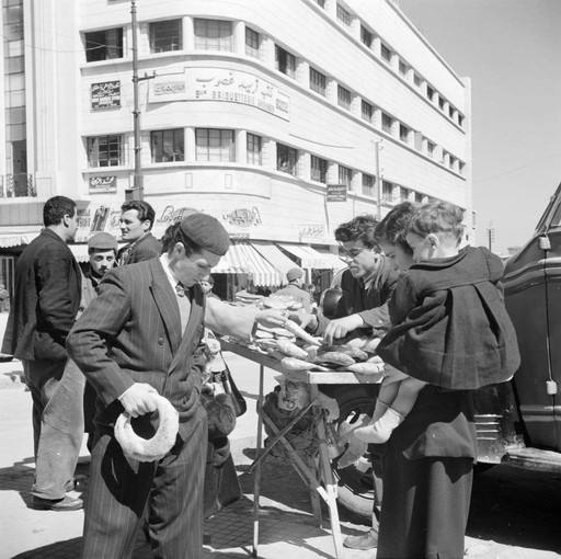 People buyin Kaak in the streets of Lebanon