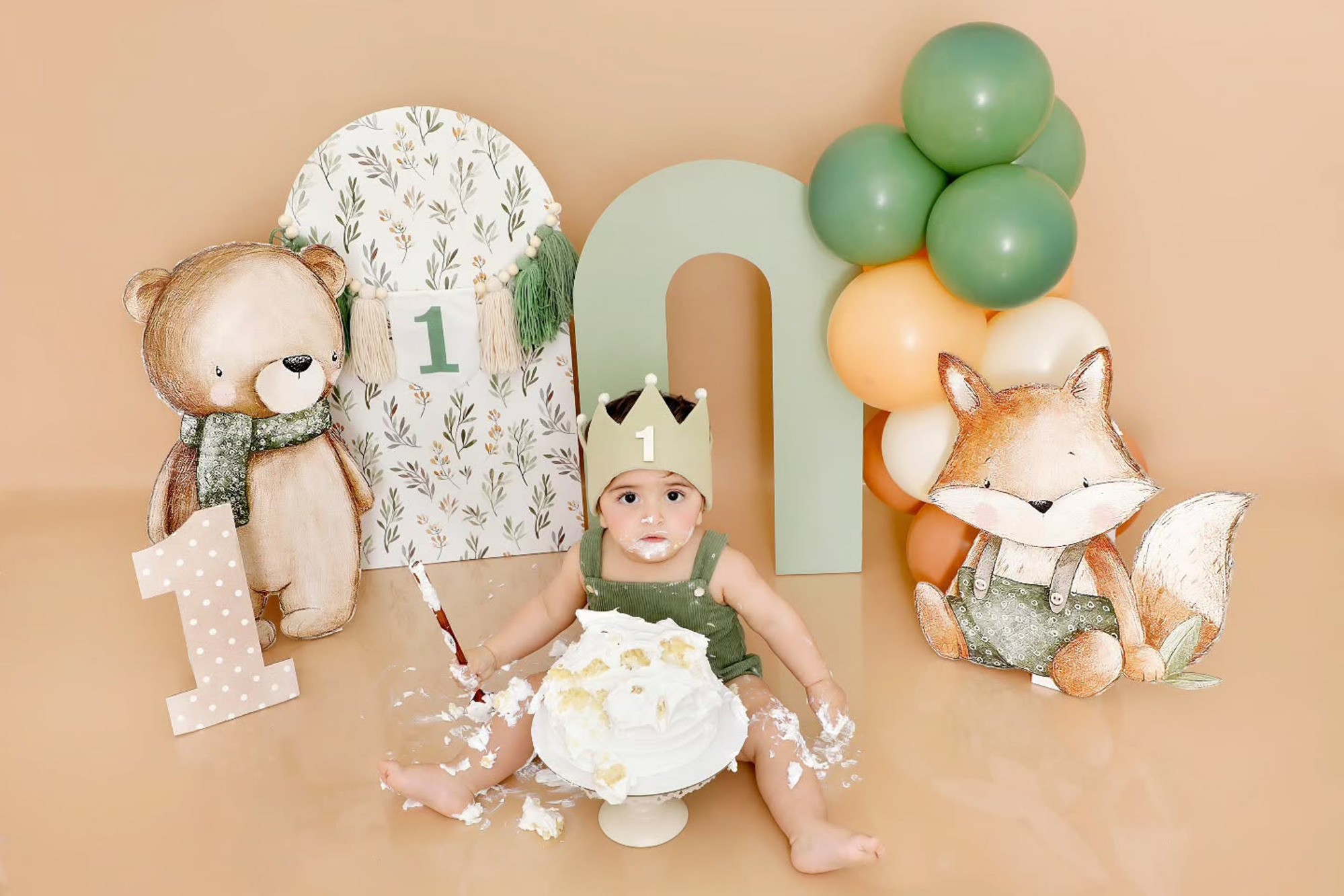 Fun and messy moments of a baby enjoying a colourful smash cake, full of laughter and joy, captured by Mahvin Photography in Dubai