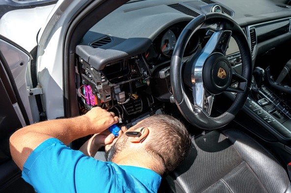 happy ford owners holding new car key made by carkeyaction