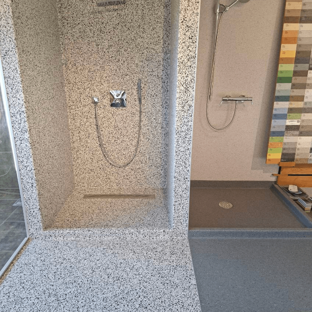 woman in black shirt and gray pants standing near white table