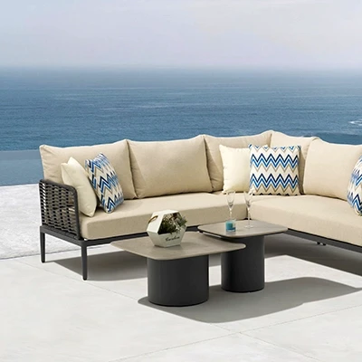 Outdoor garden furniture set from Bali COCO in a lush garden setting.