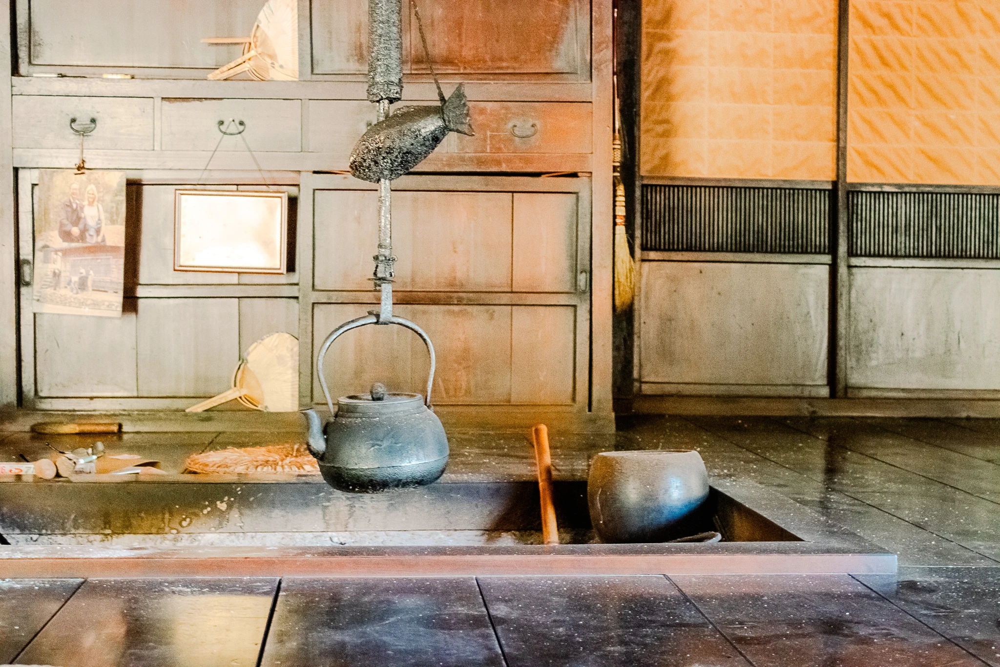 A teapot hanging in a traditional japanese living room
