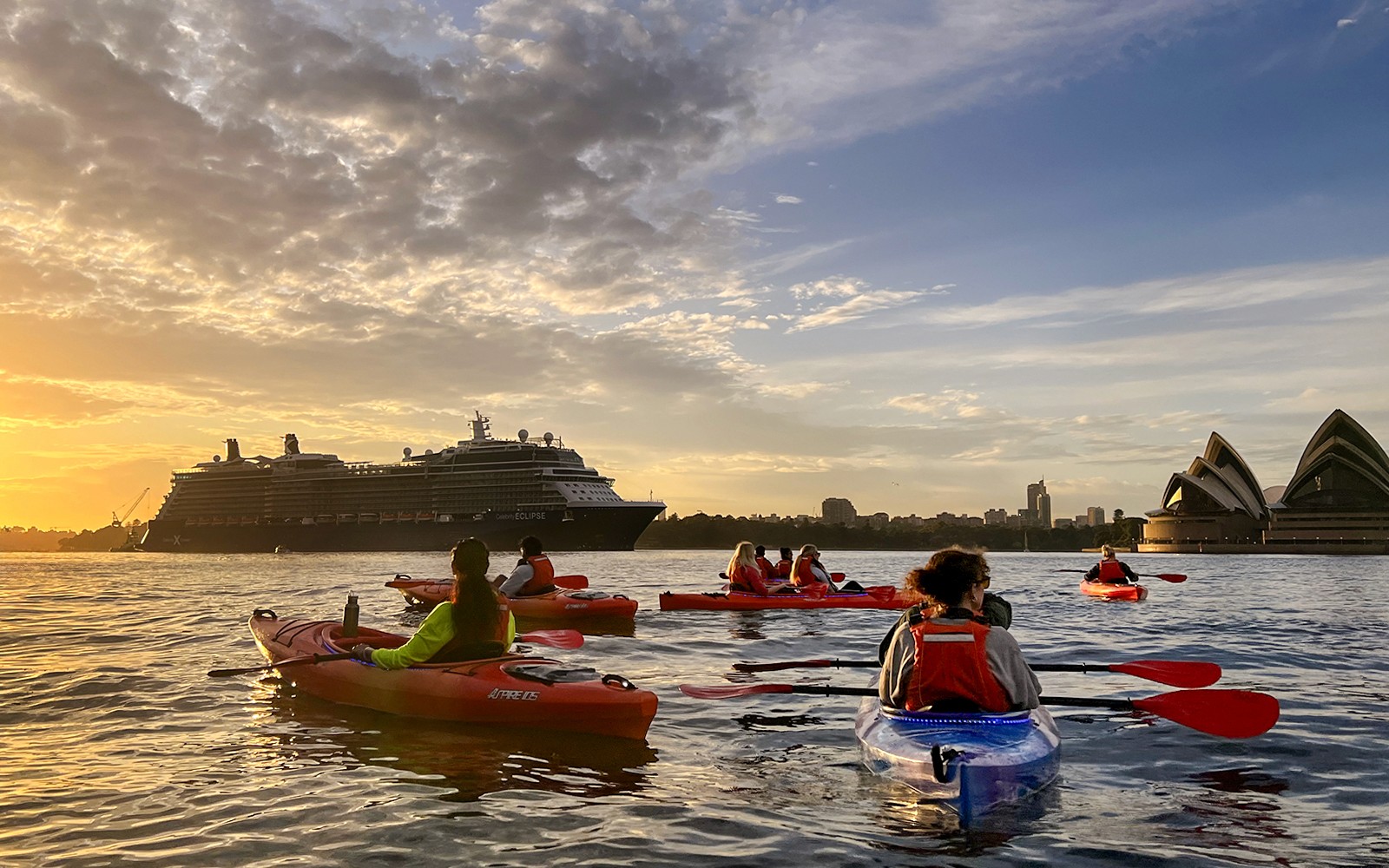 Kayaking group passing the Opera House, Sydney.