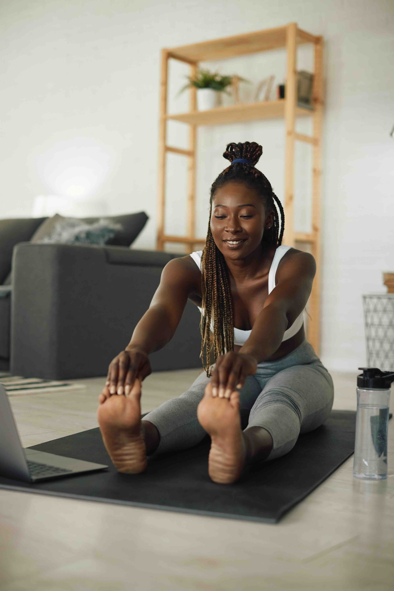 Woman doing yoga and recording class