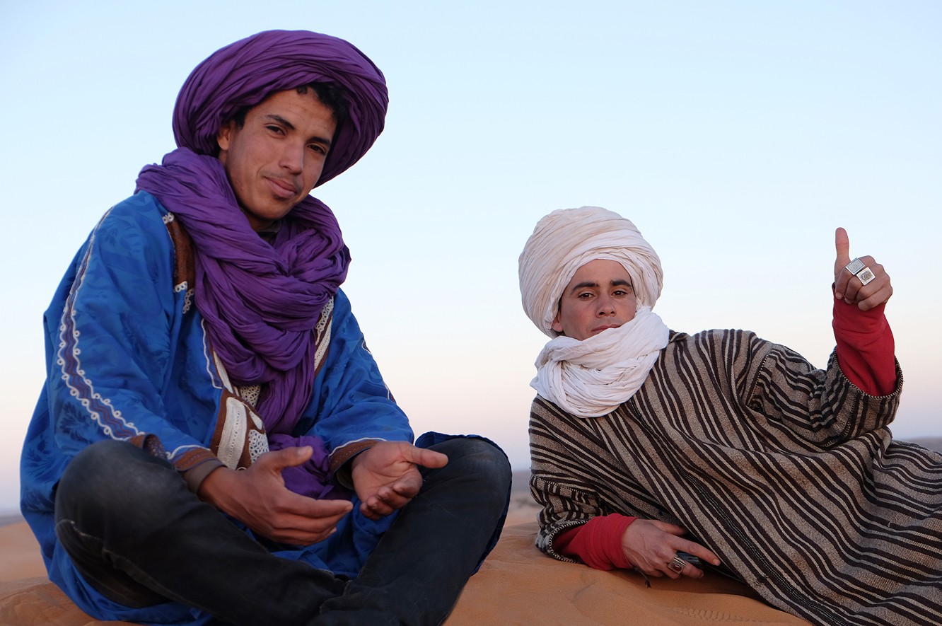 A field of white daisies with yellow centers.