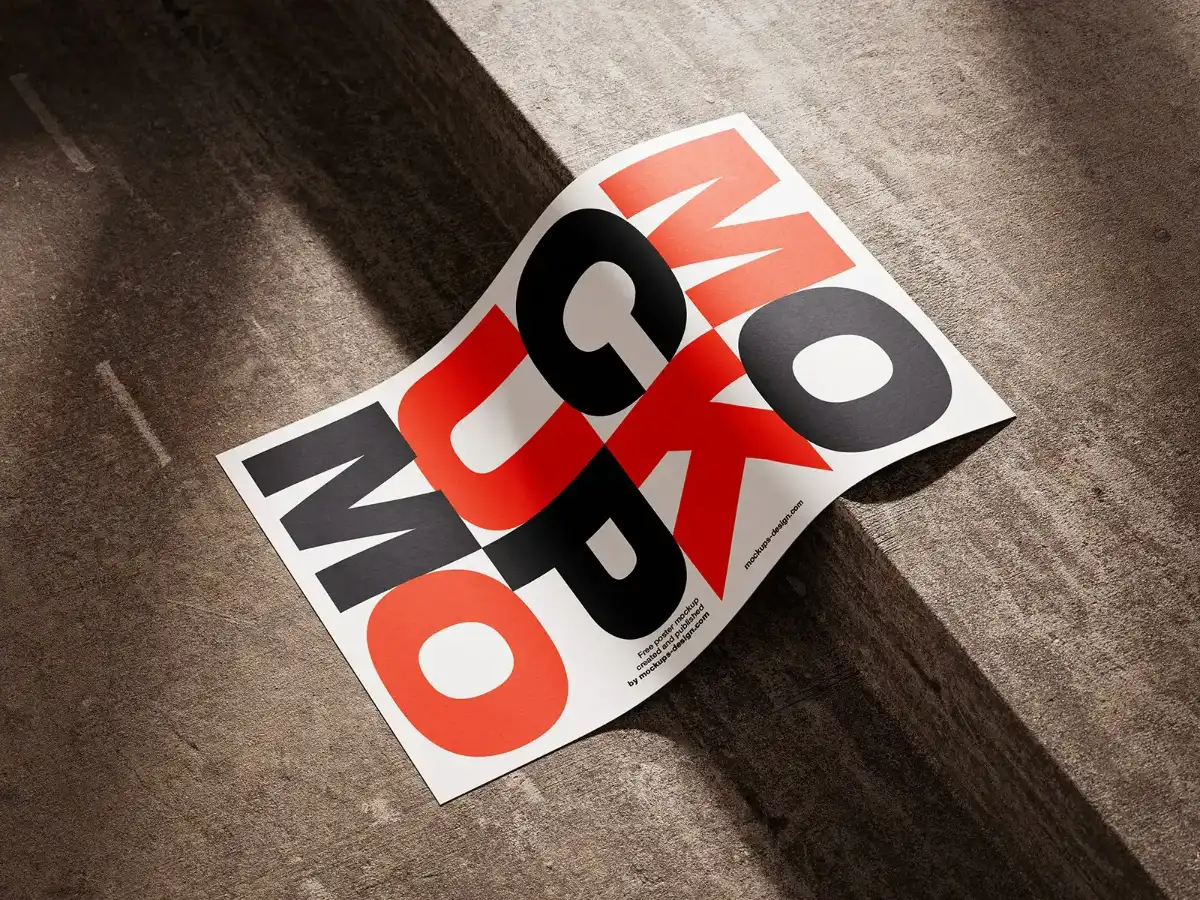 Poster mockup displayed on a concrete step, featuring bold black and red typography. The paper is slightly curled, with dramatic sunlight casting shadows, emphasizing texture and contrast. Perfect for branding showcases.