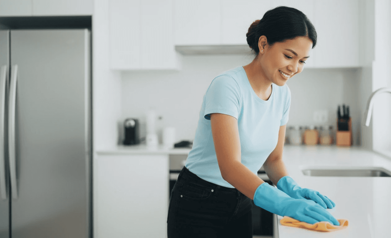 woman in white tank top holding white plastic container