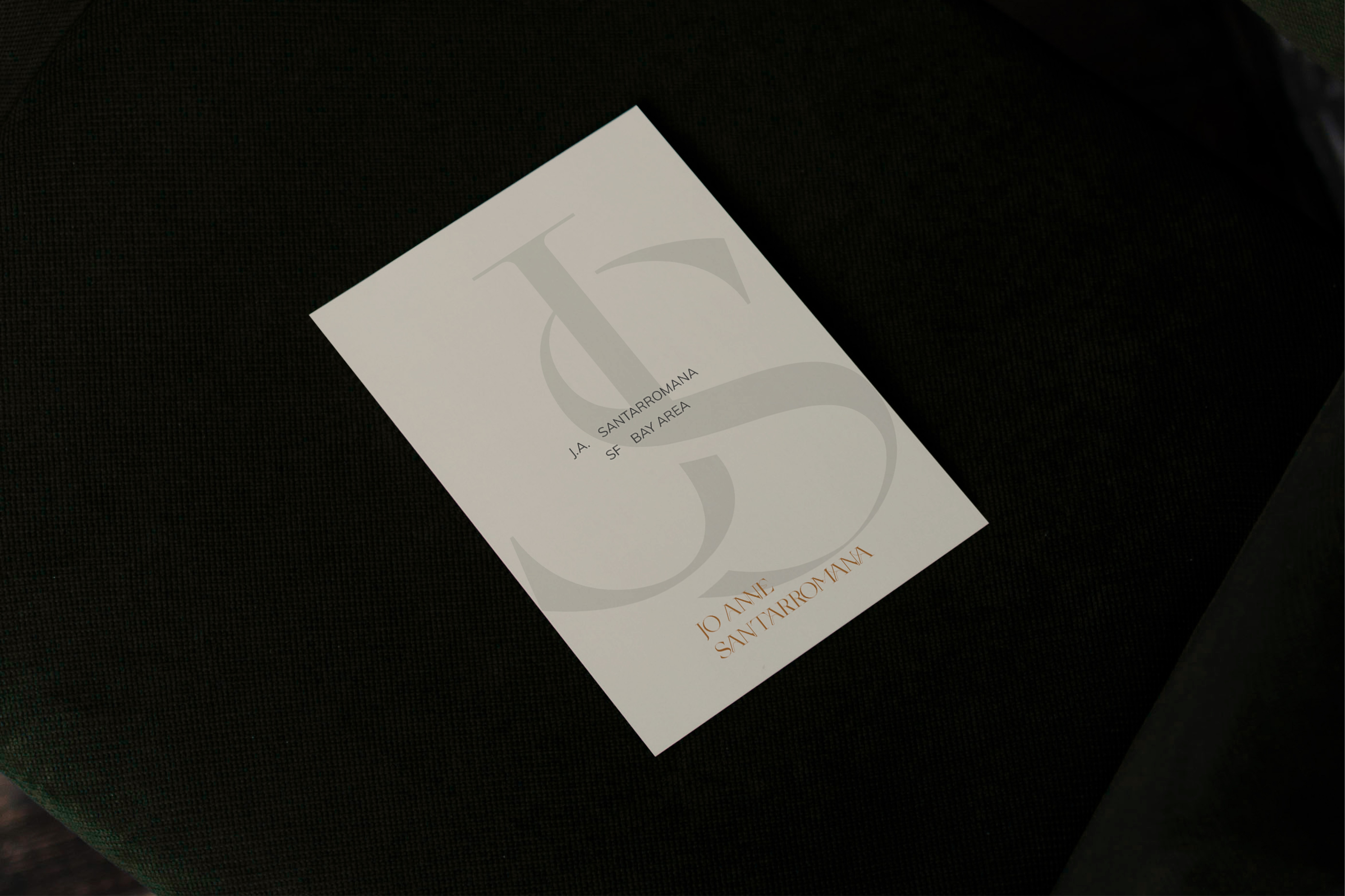 Elegant real estate branding collateral for Jo Anne Santarromana, featuring a minimalist monogram logo on a clean, off-white card.