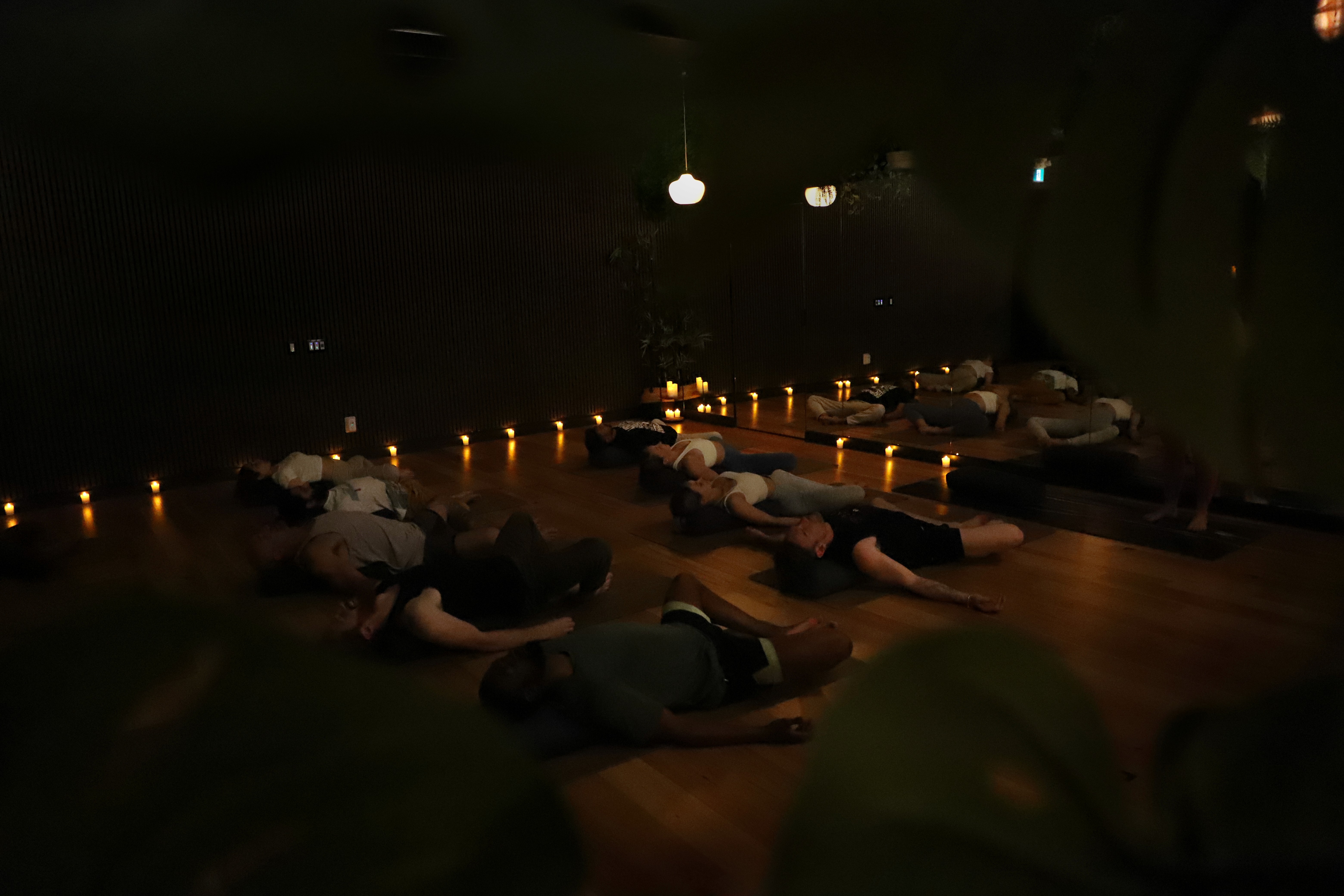 a group of students laying on yoga mats