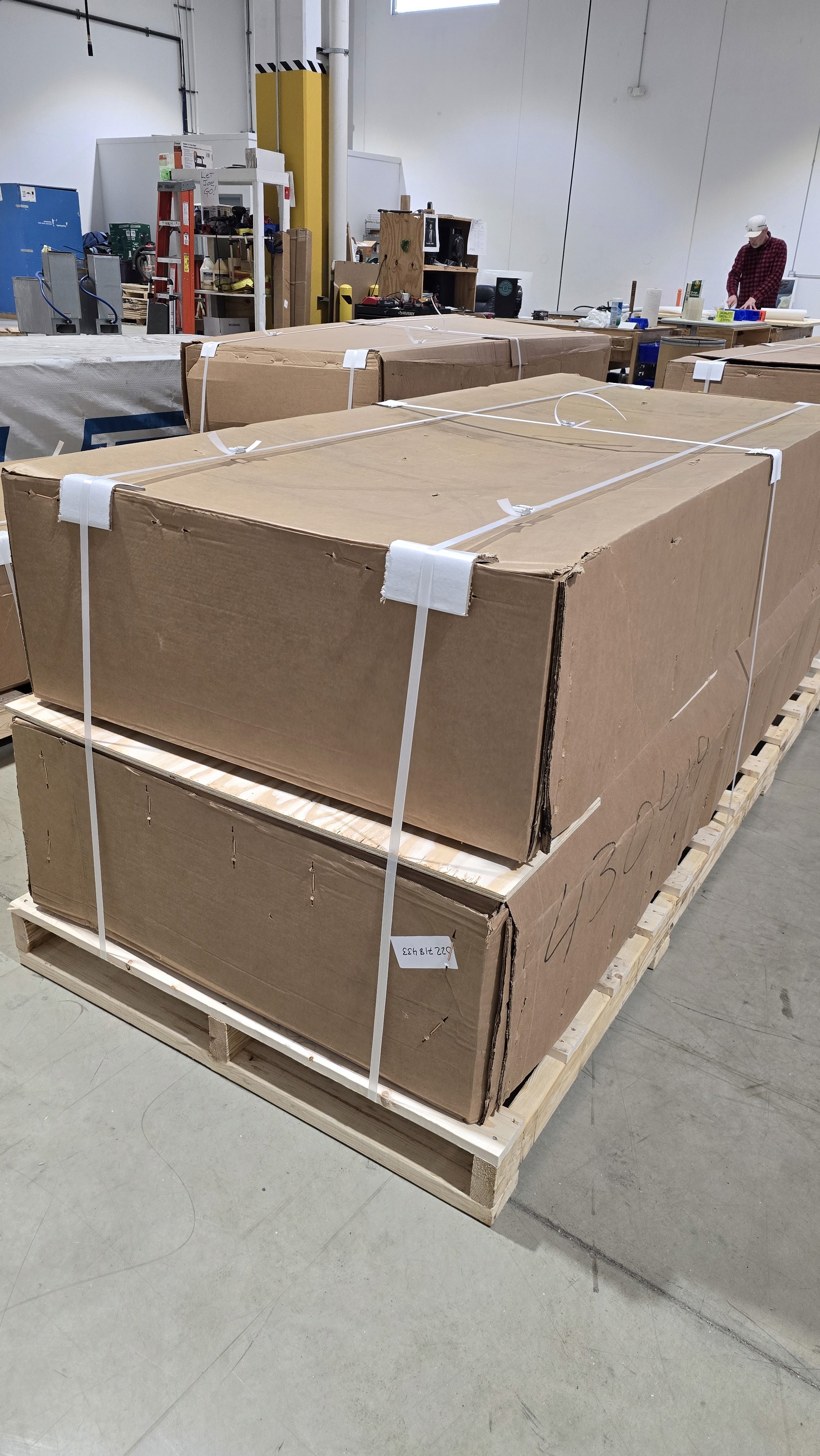 A narrow path winding through a lush, green forest surrounded by dense foliage and tall trees.