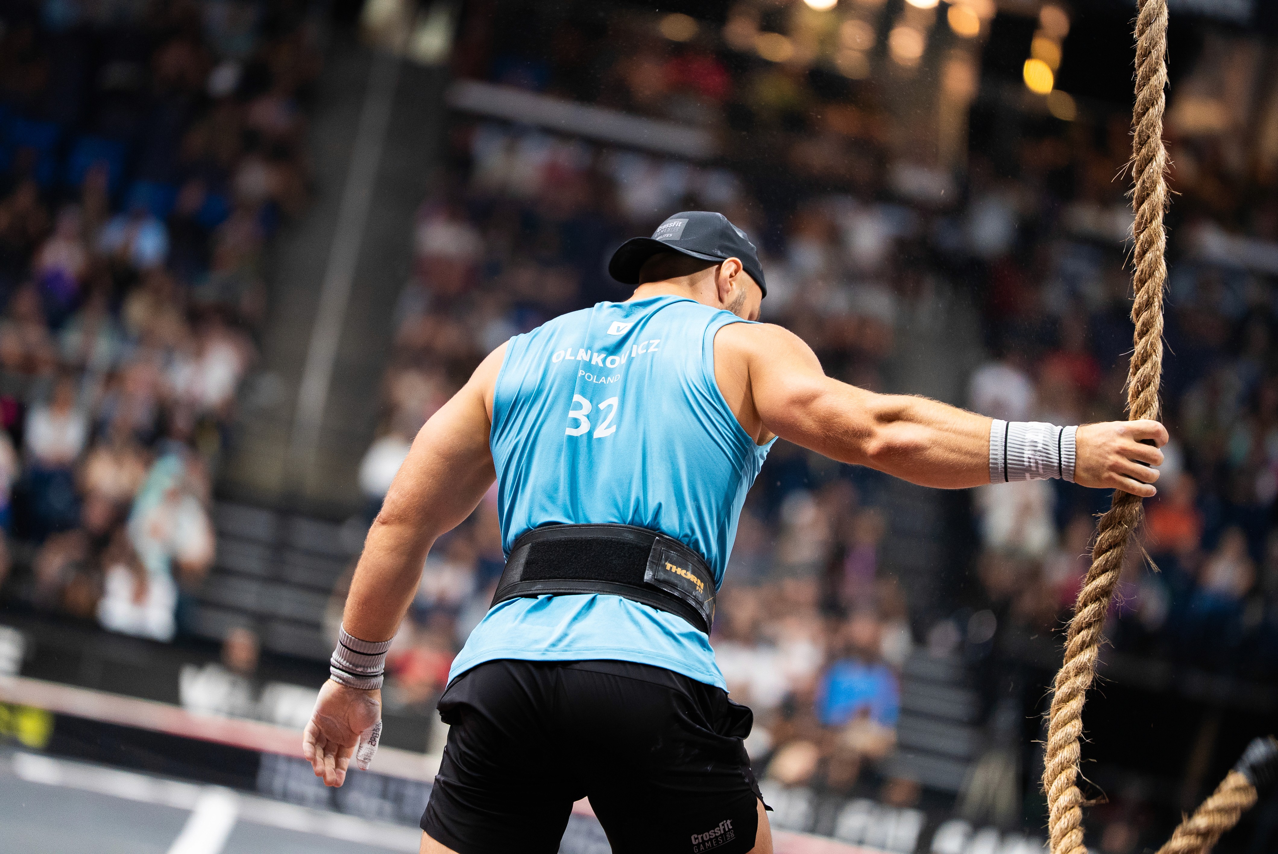 A woman with her eyes closed, wearing a helmet, appears to be in a moment of concentration or relaxation.