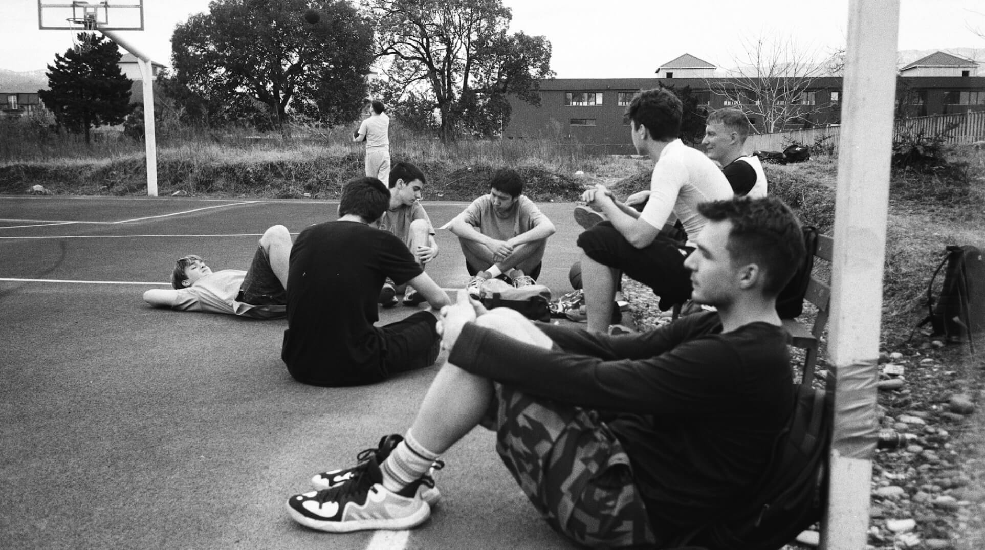 Group of people relaxing outdoors on a field or lawn