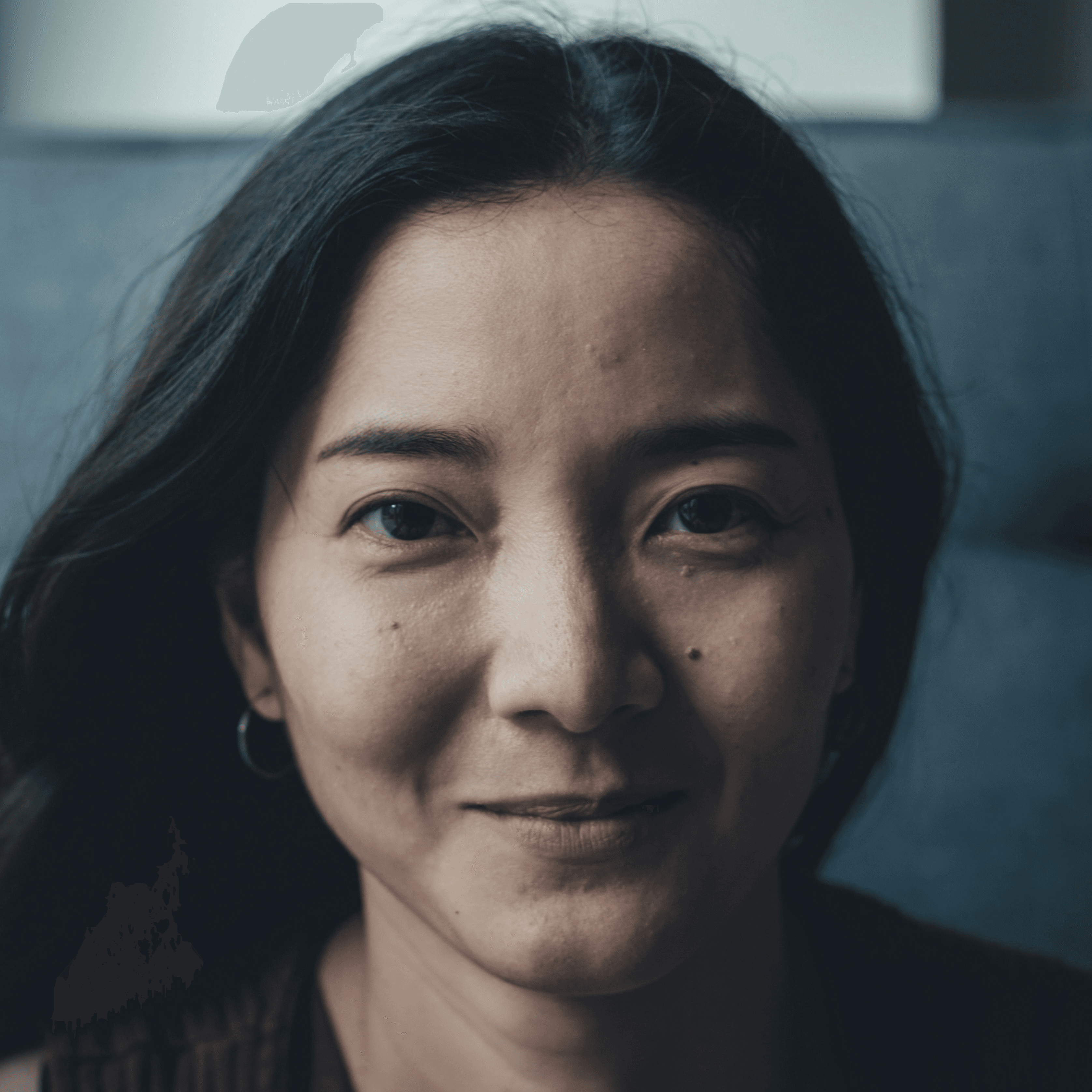 woman in black shirt smiling