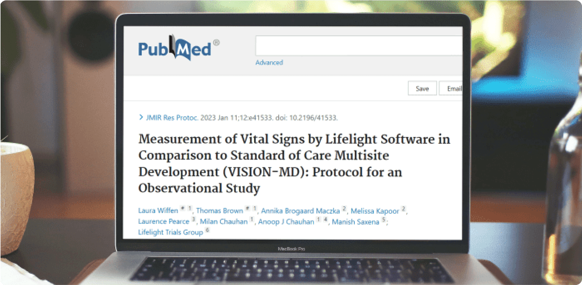 Laptop showing this paper by PubMed on its screen