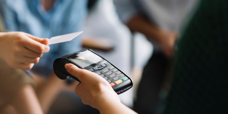 A retail customer paying for her purchase with a card