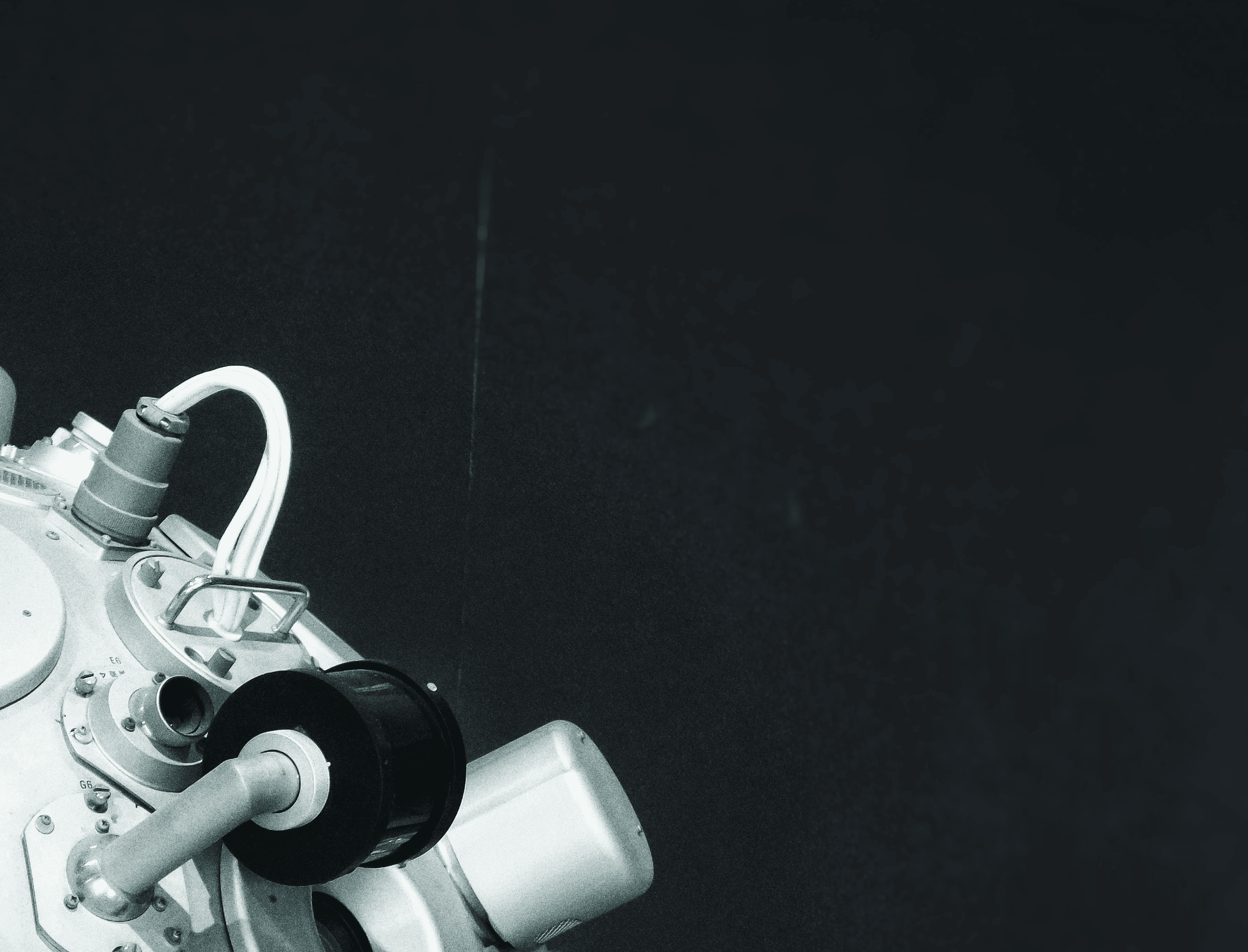 a close up of a machine with a black background