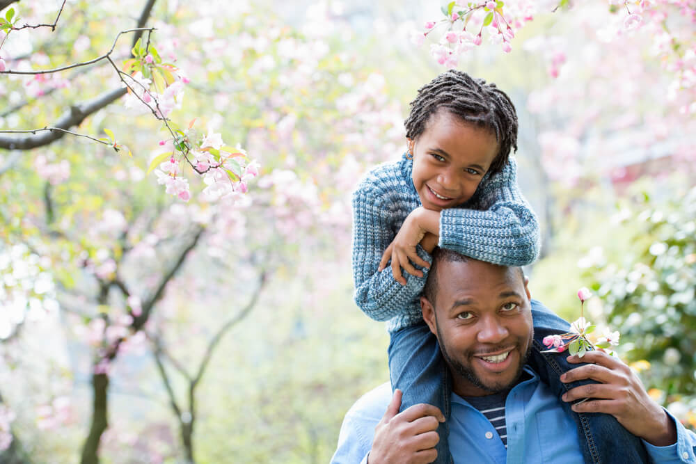 Smiling african-american father and daughter