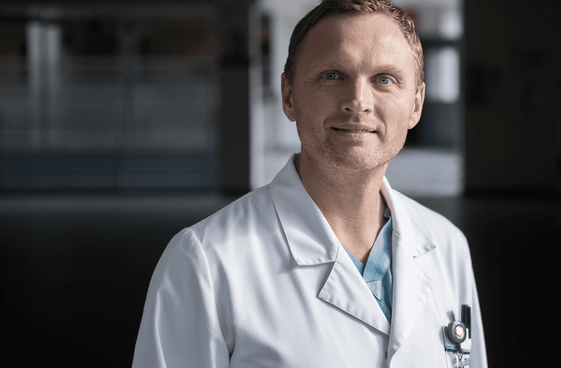 person sitting in a chair in front of a man